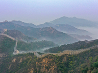 A misty morning mist hangs over the Jinshanling Great Wall in Chengde, China, on October 13, 2024. (