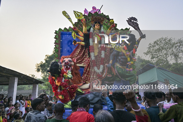 Hindu devotees carry an idol of the goddess 'Durga' during the final day (Vijaya Dashami) of the Durga Puja festival in Sylhet, Bangladesh,...