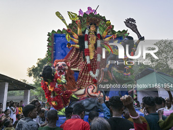 Hindu devotees carry an idol of the goddess 'Durga' during the final day (Vijaya Dashami) of the Durga Puja festival in Sylhet, Bangladesh,...