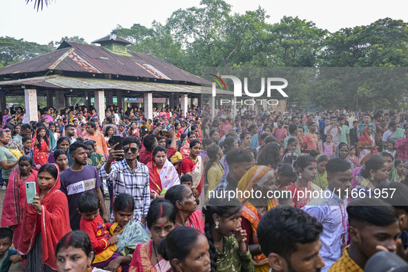 Bangladeshi Hindu devotees join a rally to immerse an idol of their deity 'Durga' during the final day (Vijaya Dashami) of the Durga Puja fe...