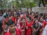 Bangladeshi Hindu devotees dance and join a rally to immerse an idol of their deity 'Durga' during the final day (Vijaya Dashami) of the Dur...