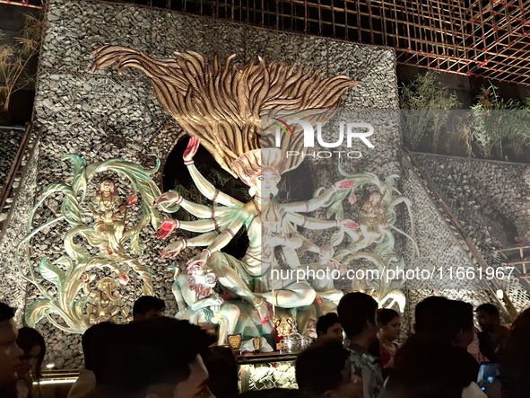 Devotees visit the Puja Pandal during the Dushhera-Vijaya Dashami festival on the final day of Durga Puja in Siliguri, India, on October 13,...