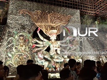 Devotees visit the Puja Pandal during the Dushhera-Vijaya Dashami festival on the final day of Durga Puja in Siliguri, India, on October 13,...