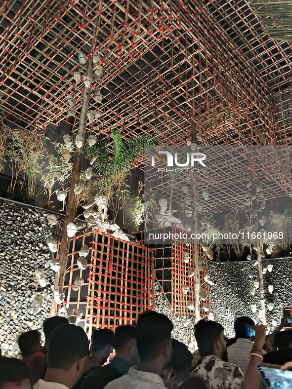 Devotees visit the Puja Pandal during the Dushhera-Vijaya Dashami festival on the final day of Durga Puja in Siliguri, India, on October 13,...