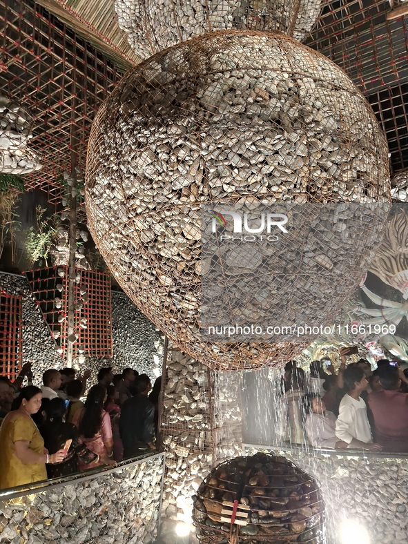 Devotees visit the Puja Pandal during the Dushhera-Vijaya Dashami festival on the final day of Durga Puja in Siliguri, India, on October 13,...