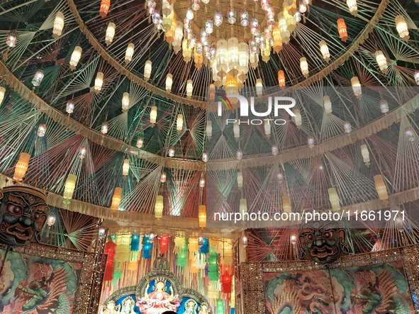 Devotees visit the Puja Pandal during the Dushhera-Vijaya Dashami festival on the final day of Durga Puja in Siliguri, India, on October 13,...