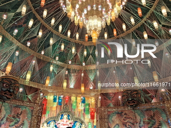 Devotees visit the Puja Pandal during the Dushhera-Vijaya Dashami festival on the final day of Durga Puja in Siliguri, India, on October 13,...