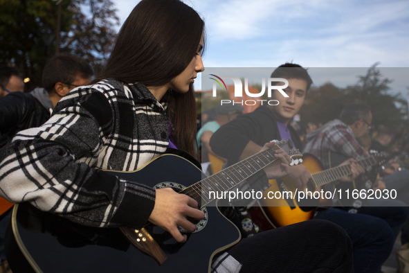 Guitar players simultaneously play the song ''Oath'' in Sofia, Bulgaria, on October 13, 2024, in memory of the legendary rock musician Kiril...