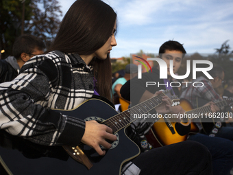 Guitar players simultaneously play the song ''Oath'' in Sofia, Bulgaria, on October 13, 2024, in memory of the legendary rock musician Kiril...