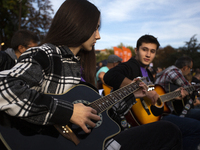 Guitar players simultaneously play the song ''Oath'' in Sofia, Bulgaria, on October 13, 2024, in memory of the legendary rock musician Kiril...