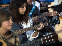 Guitar players simultaneously play the song ''Oath'' in Sofia, Bulgaria, on October 13, 2024, in memory of the legendary rock musician Kiril...