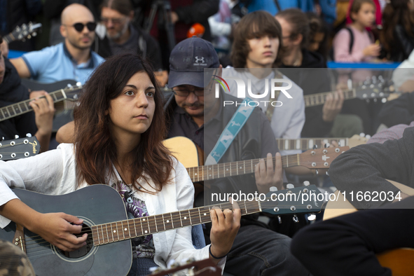 Guitar players simultaneously play the song ''Oath'' in Sofia, Bulgaria, on October 13, 2024, in memory of the legendary rock musician Kiril...