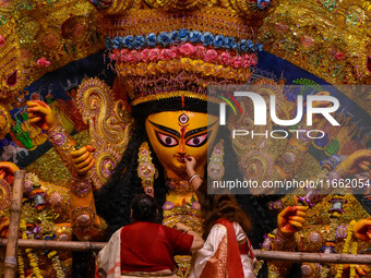 Married women offer their final prayer to Goddess Durga by presenting vermillion and sweets before the immersion of Durga idols on the last...