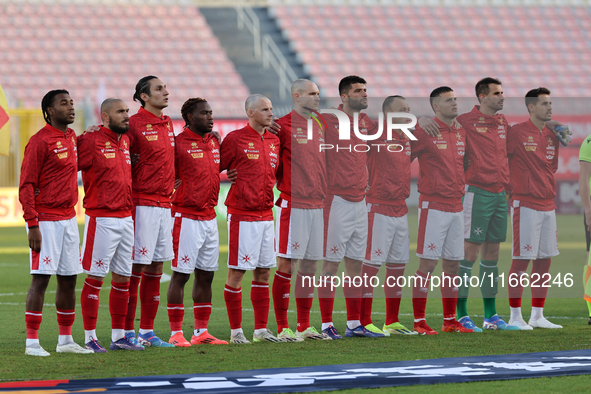 The Malta national soccer team stands during the playing of their country's national anthem prior to the UEFA Nations League, League D, Grou...