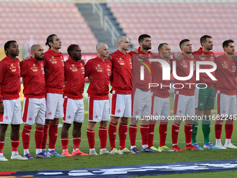 The Malta national soccer team stands during the playing of their country's national anthem prior to the UEFA Nations League, League D, Grou...