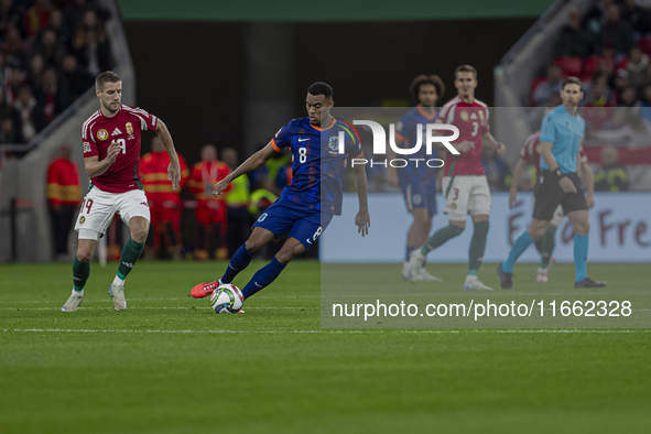 Ryan Gravenberch of the Netherlands competes for the ball with Barnabas Varga of Hungary during the UEFA Nations League Group match at Puska...