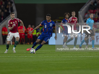 Ryan Gravenberch of the Netherlands competes for the ball with Barnabas Varga of Hungary during the UEFA Nations League Group match at Puska...