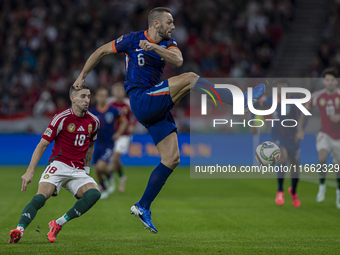 Stefan De Vrij of the Netherlands competes for the ball with Zsolt Nagy of Hungary during the UEFA Nations League Group match at Puskas Aren...