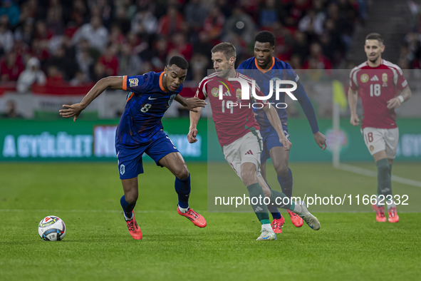 Barnabas Varga of Hungary competes for the ball with Denzel Dumfries of the Netherlands during the UEFA Nations League Group match at Puskas...