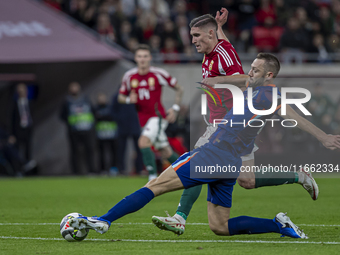 Roland Sallai of Hungary competes for the ball with Stefan De Vrij of the Netherlands during the UEFA Nations League Group match at Puskas A...