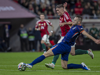 Roland Sallai of Hungary competes for the ball with Stefan De Vrij of the Netherlands during the UEFA Nations League Group match at Puskas A...