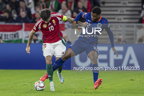 Dominik Szoboszlai of Hungary competes for the ball with Denzel Dumfries of the Netherlands during the UEFA Nations League Group match at Pu...