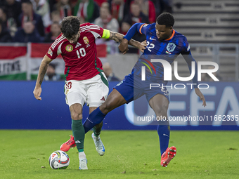 Dominik Szoboszlai of Hungary competes for the ball with Denzel Dumfries of the Netherlands during the UEFA Nations League Group match at Pu...