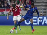 Dominik Szoboszlai of Hungary competes for the ball with Denzel Dumfries of the Netherlands during the UEFA Nations League Group match at Pu...