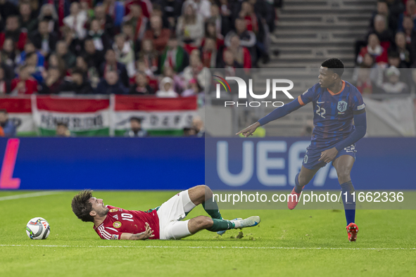 Dominik Szoboszlai of Hungary competes for the ball with Denzel Dumfries of the Netherlands during the UEFA Nations League Group match at Pu...