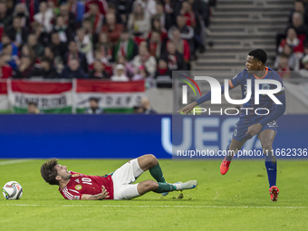 Dominik Szoboszlai of Hungary competes for the ball with Denzel Dumfries of the Netherlands during the UEFA Nations League Group match at Pu...