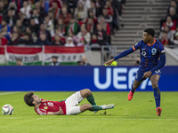 Dominik Szoboszlai of Hungary competes for the ball with Denzel Dumfries of the Netherlands during the UEFA Nations League Group match at Pu...