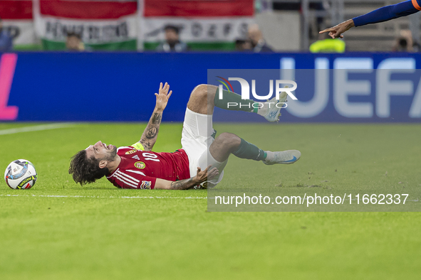 Dominik Szoboszlai of Hungary competes for the ball with Denzel Dumfries of the Netherlands during the UEFA Nations League Group match at Pu...