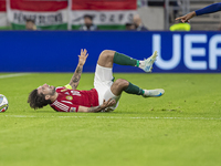 Dominik Szoboszlai of Hungary competes for the ball with Denzel Dumfries of the Netherlands during the UEFA Nations League Group match at Pu...