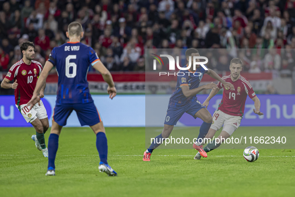 Ryan Gravenberch of the Netherlands competes for the ball with Barnabas Varga of Hungary during the UEFA Nations League Group match at Puska...