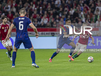 Ryan Gravenberch of the Netherlands competes for the ball with Barnabas Varga of Hungary during the UEFA Nations League Group match at Puska...