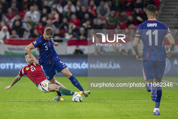 Micky van de Ven of the Netherlands competes for the ball with Endre Botka of Hungary during the UEFA Nations League Group match at Puskas A...