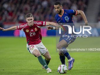 Roland Sallai of Hungary competes for the ball with Cody Gakpo of the Netherlands during the UEFA Nations League Group match at Puskas Arena...