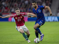 Roland Sallai of Hungary competes for the ball with Cody Gakpo of the Netherlands during the UEFA Nations League Group match at Puskas Arena...