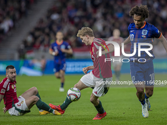 Andras Schafer of Hungary competes for the ball with Joshua Zirkzee of the Netherlands during the UEFA Nations League Group match at Puskas...