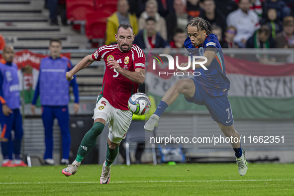 Xavi Simons of the Netherlands competes for the ball with Attila Fiola of Hungary during the UEFA Nations League Group match at Puskas Arena...