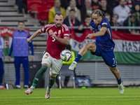 Xavi Simons of the Netherlands competes for the ball with Attila Fiola of Hungary during the UEFA Nations League Group match at Puskas Arena...