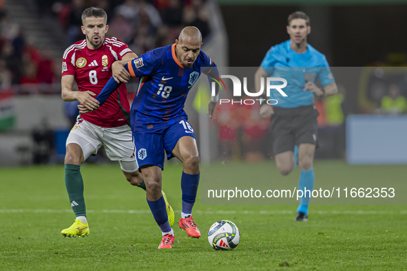 Quinten Timber of the Netherlands competes for the ball with Adam Nagy of Hungary during the UEFA Nations League Group match at Puskas Arena...