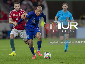 Quinten Timber of the Netherlands competes for the ball with Adam Nagy of Hungary during the UEFA Nations League Group match at Puskas Arena...