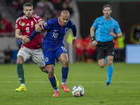 Quinten Timber of the Netherlands competes for the ball with Adam Nagy of Hungary during the UEFA Nations League Group match at Puskas Arena...