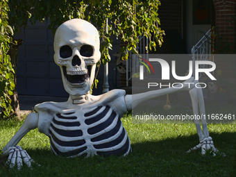 A giant skeleton stands outside a house in preparation for Halloween in Markham, Ontario, Canada, on October 12, 2024. (