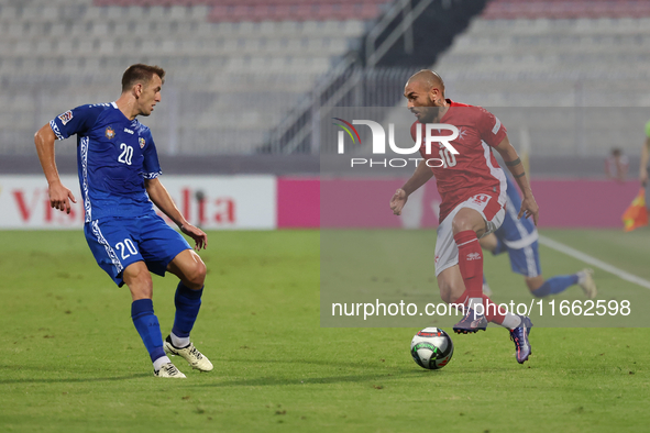 Teddy Teuma of Malta is closely followed by Sergiu Platica of Moldova during the UEFA Nations League, League D, Group D2 soccer match betwee...