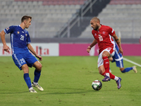 Teddy Teuma of Malta is closely followed by Sergiu Platica of Moldova during the UEFA Nations League, League D, Group D2 soccer match betwee...