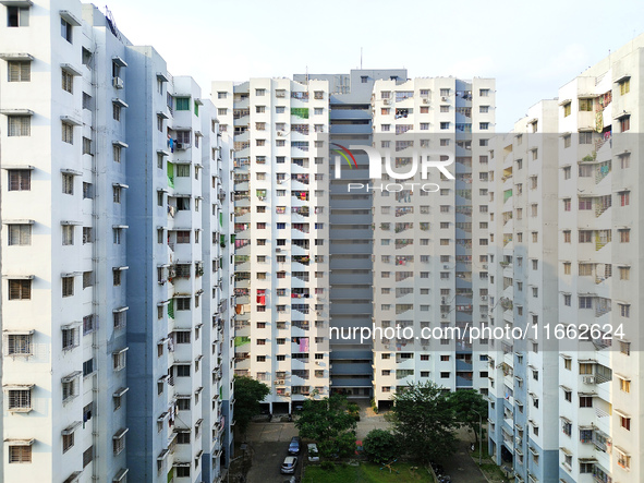 Residents of a high-rise residential building appear in Kolkata, India, on October 11, 2024. 