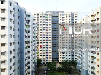 Residents of a high-rise residential building appear in Kolkata, India, on October 11, 2024. (