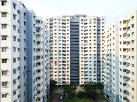 Residents of a high-rise residential building appear in Kolkata, India, on October 11, 2024. (